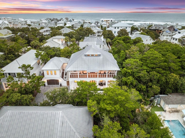 aerial view at dusk with a water view