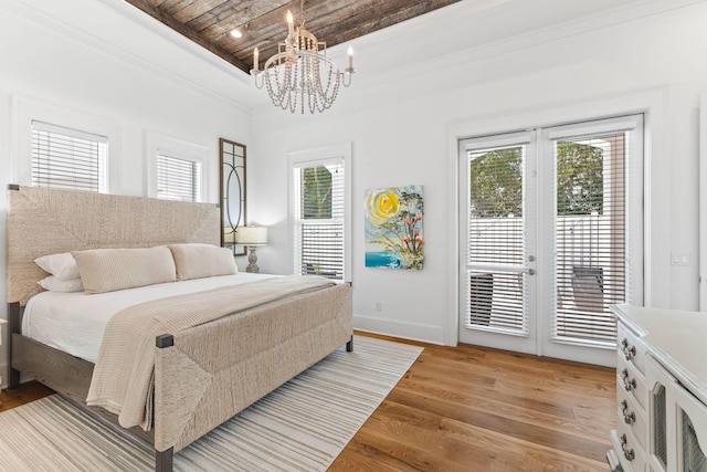 bedroom featuring french doors, wood ceiling, crown molding, access to exterior, and light hardwood / wood-style floors