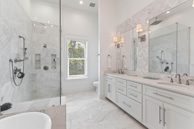 full bathroom featuring toilet, ornamental molding, shower with separate bathtub, and vanity