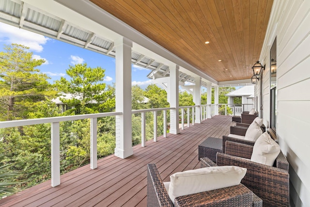 wooden deck featuring outdoor lounge area