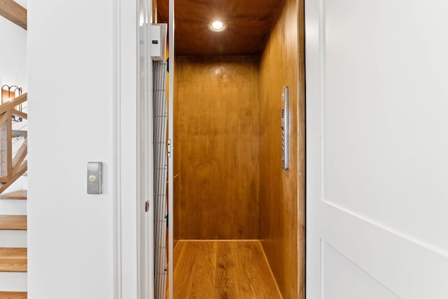 room details featuring wood-type flooring and elevator