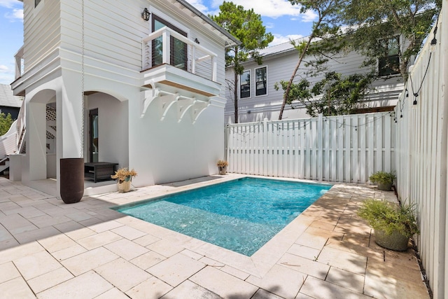 view of pool featuring a patio