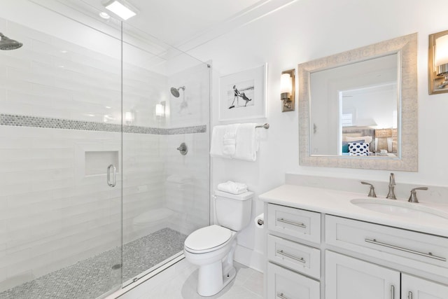 bathroom with toilet, ornamental molding, vanity, a shower with door, and tile patterned flooring