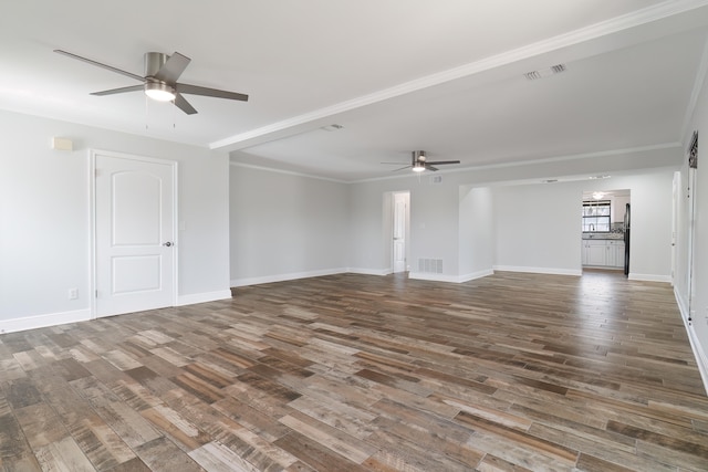 unfurnished living room with crown molding, dark wood-type flooring, and ceiling fan