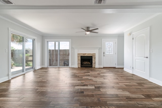 unfurnished living room featuring a wealth of natural light, ceiling fan, and crown molding