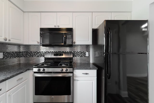 kitchen with dark stone countertops, white cabinetry, black appliances, and tasteful backsplash