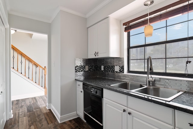 kitchen with white cabinetry, black dishwasher, pendant lighting, decorative backsplash, and sink