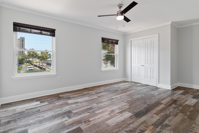356 Billfish Ave Unit 8, Fort Walton Beach, FL 32548 - unfurnished bedroom featuring wood finished floors, a closet, crown molding, baseboards, and ceiling fan