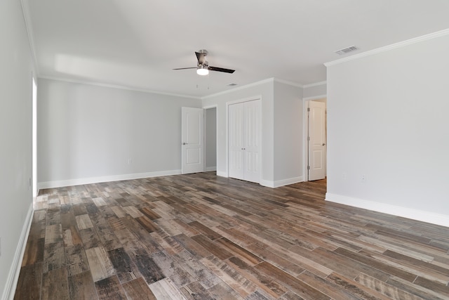 unfurnished room with crown molding, dark hardwood / wood-style flooring, and ceiling fan