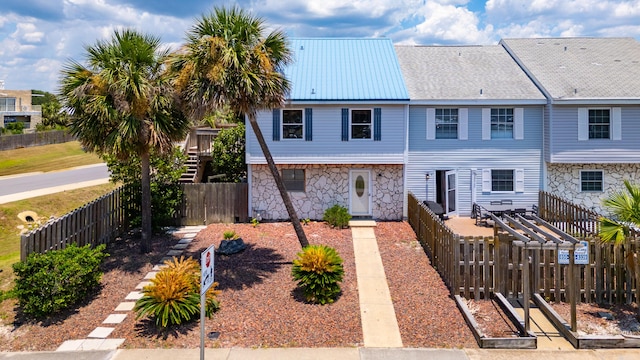 356 Billfish Ave Unit 8, Fort Walton Beach, FL 32548 - multi unit property with stone siding, metal roof, and a fenced backyard