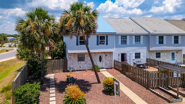 356 Billfish Ave Unit 8, Fort Walton Beach, FL 32548 - back of property with stone siding and a fenced backyard