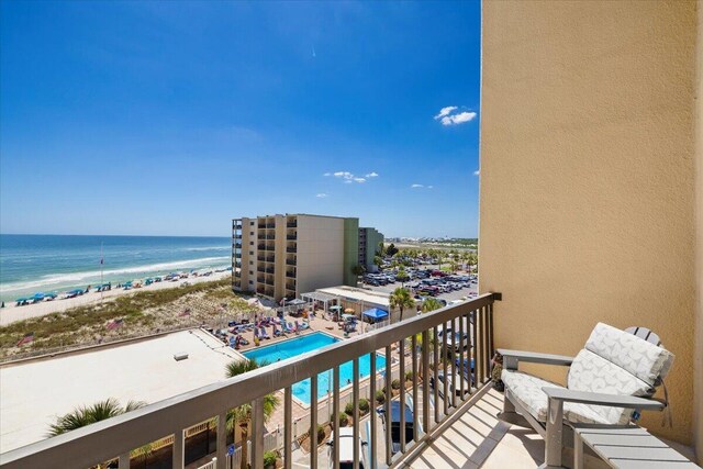 balcony featuring a water view