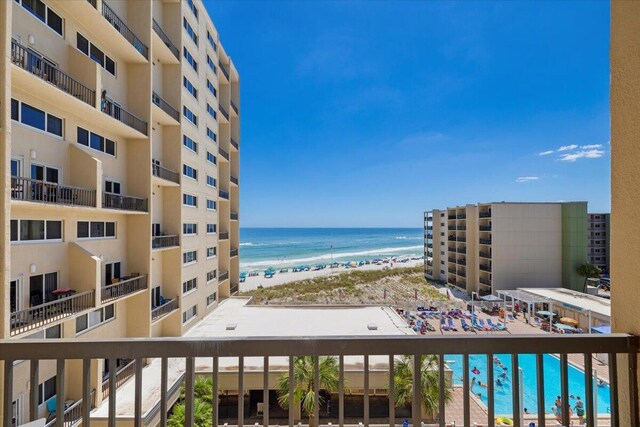 exterior space with a water view and a community pool