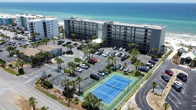 bird's eye view with a water view, a beach view, and a city view