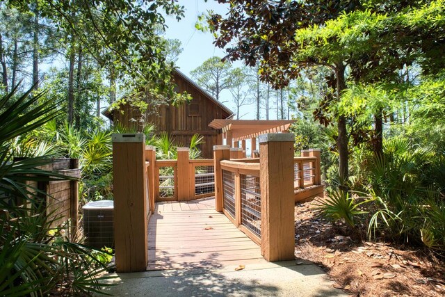 exterior space featuring a pergola and central AC