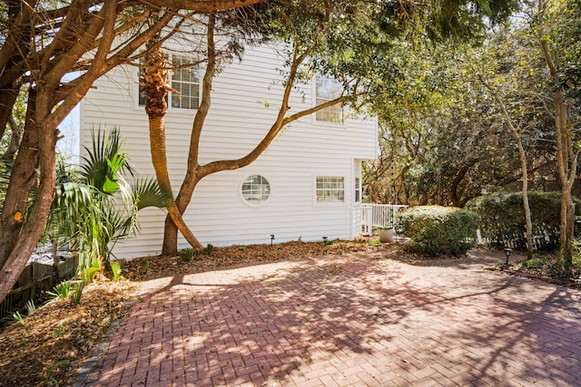 view of property exterior featuring a patio