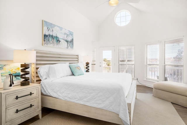 bedroom featuring ceiling fan, high vaulted ceiling, and light hardwood / wood-style floors