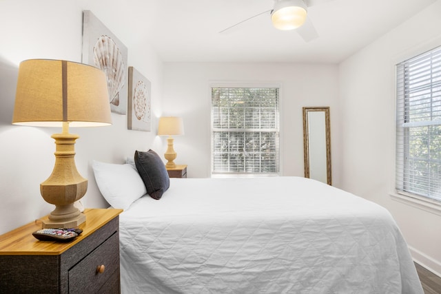 bedroom with wood-type flooring and ceiling fan