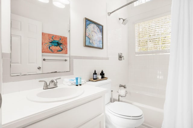 full bathroom featuring toilet, vanity, and shower / tub combo with curtain