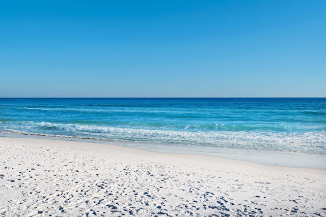 property view of water featuring a beach view