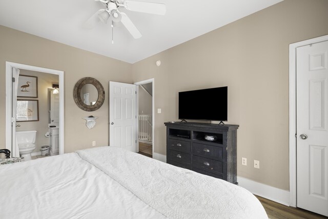 bedroom with connected bathroom, dark hardwood / wood-style floors, and ceiling fan