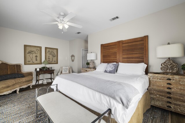 bedroom with ceiling fan, a closet, and dark wood-type flooring