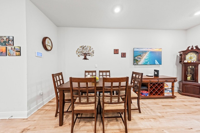 dining area featuring light wood-type flooring