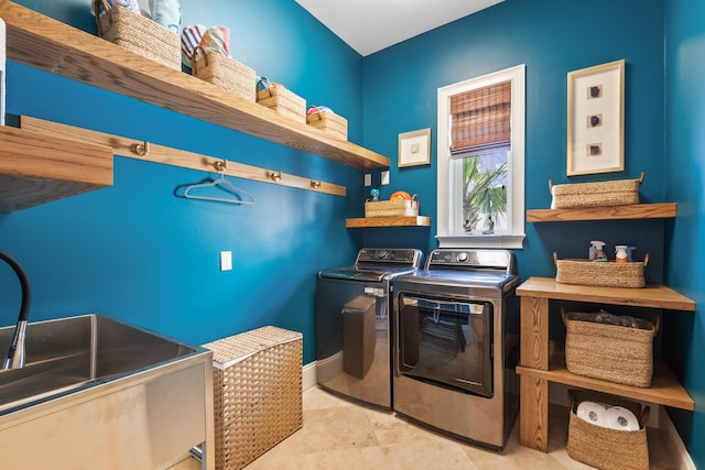 laundry room with sink and washing machine and clothes dryer