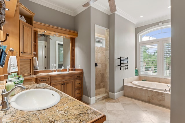 bathroom featuring ceiling fan, vanity, independent shower and bath, and ornamental molding