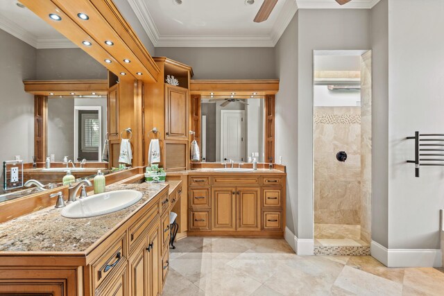 bathroom featuring a shower, vanity, crown molding, and ceiling fan