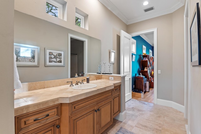 bathroom with vanity and crown molding