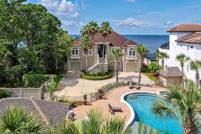 view of swimming pool with a water view