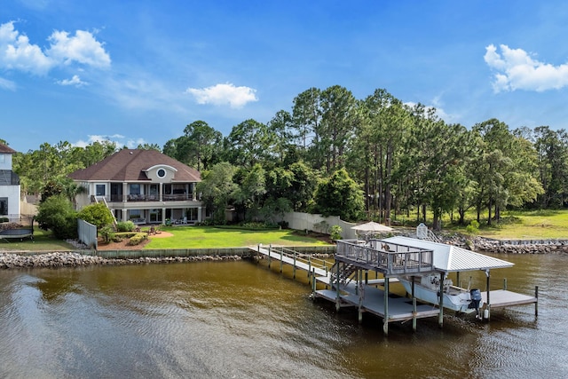 dock area featuring a water view and a lawn