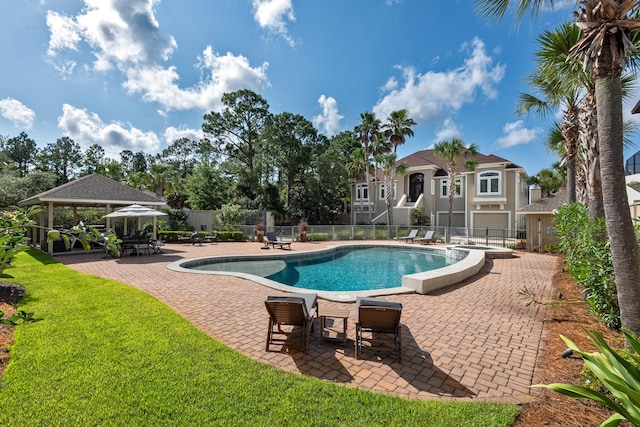 view of swimming pool with a gazebo and a patio area