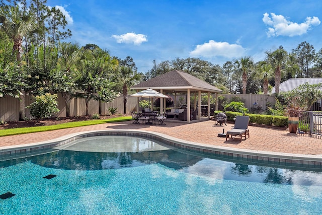 view of swimming pool with an outdoor hangout area, a gazebo, and a patio