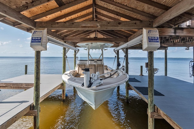 dock area featuring a water view