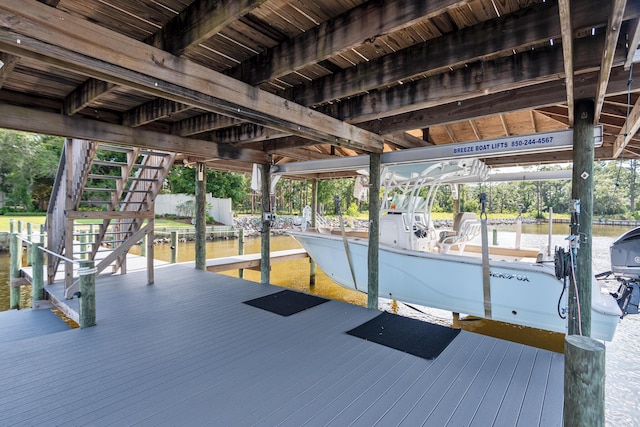 wooden deck with a boat dock