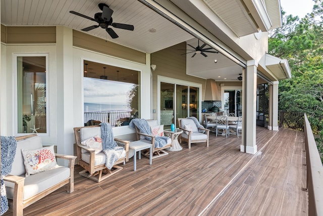 deck with ceiling fan and outdoor lounge area