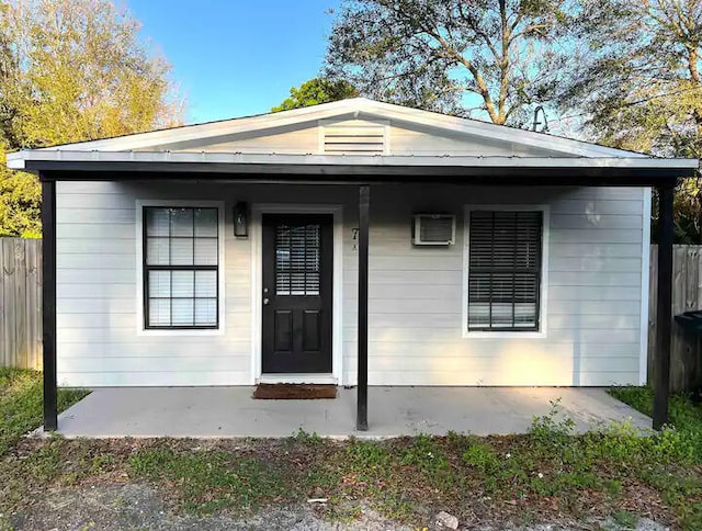 bungalow-style home with a patio area