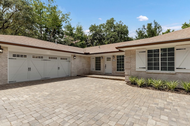 ranch-style home with a garage