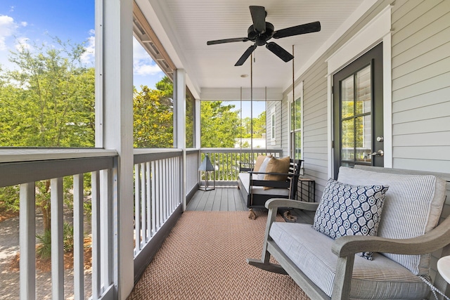 sunroom / solarium with ceiling fan