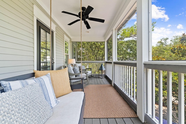 sunroom / solarium featuring ceiling fan