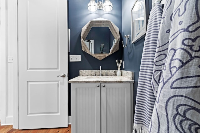 bathroom featuring wood-type flooring and vanity