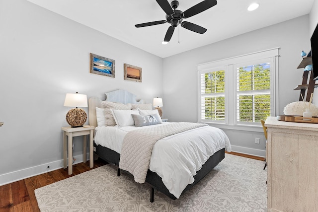 bedroom featuring recessed lighting, baseboards, wood finished floors, and a ceiling fan