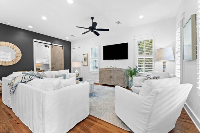 51 Bramble Ln, Santa Rosa Beach, FL 32459 - living room with a barn door, wood finished floors, ceiling fan, and recessed lighting