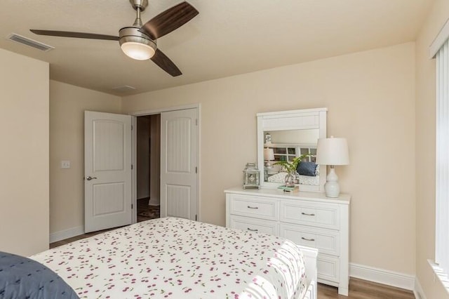 bedroom featuring ceiling fan and dark hardwood / wood-style flooring