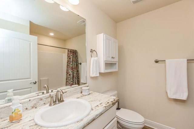6022 Willsey Trl, Crestview, FL 32539 - bathroom with vanity, toilet, a shower with curtain, and baseboards