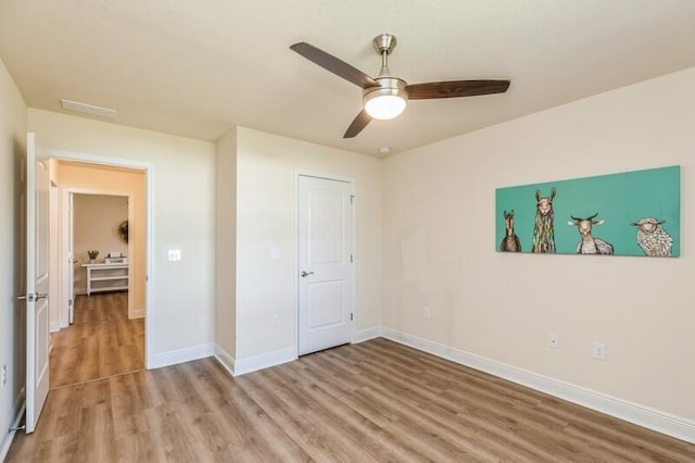 6022 Willsey Trl, Crestview, FL 32539 - bedroom with baseboards, a ceiling fan, and light wood finished floors