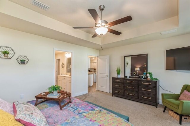 6022 Willsey Trl, Crestview, FL 32539 - bedroom with light carpet, visible vents, baseboards, and a tray ceiling