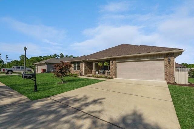 single story home with a front lawn and a garage